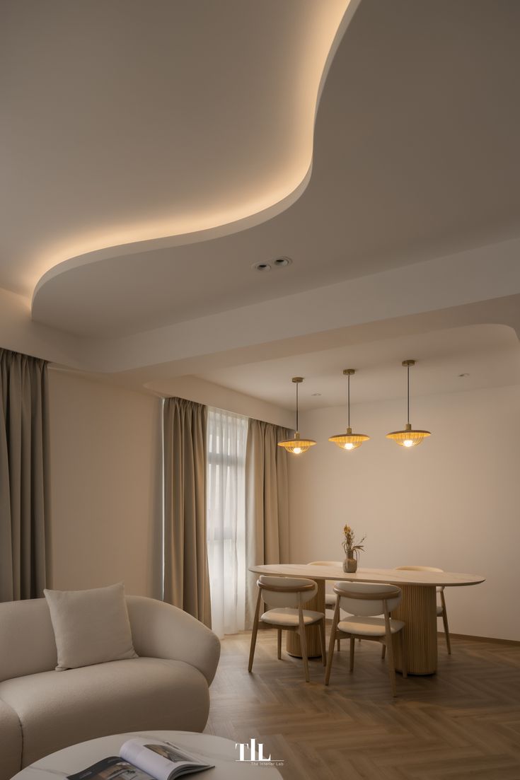 Flowing curved false ceiling with warm concealed lighting