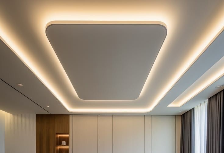 Double-layer false ceiling with rounded corners and warm cove lighting