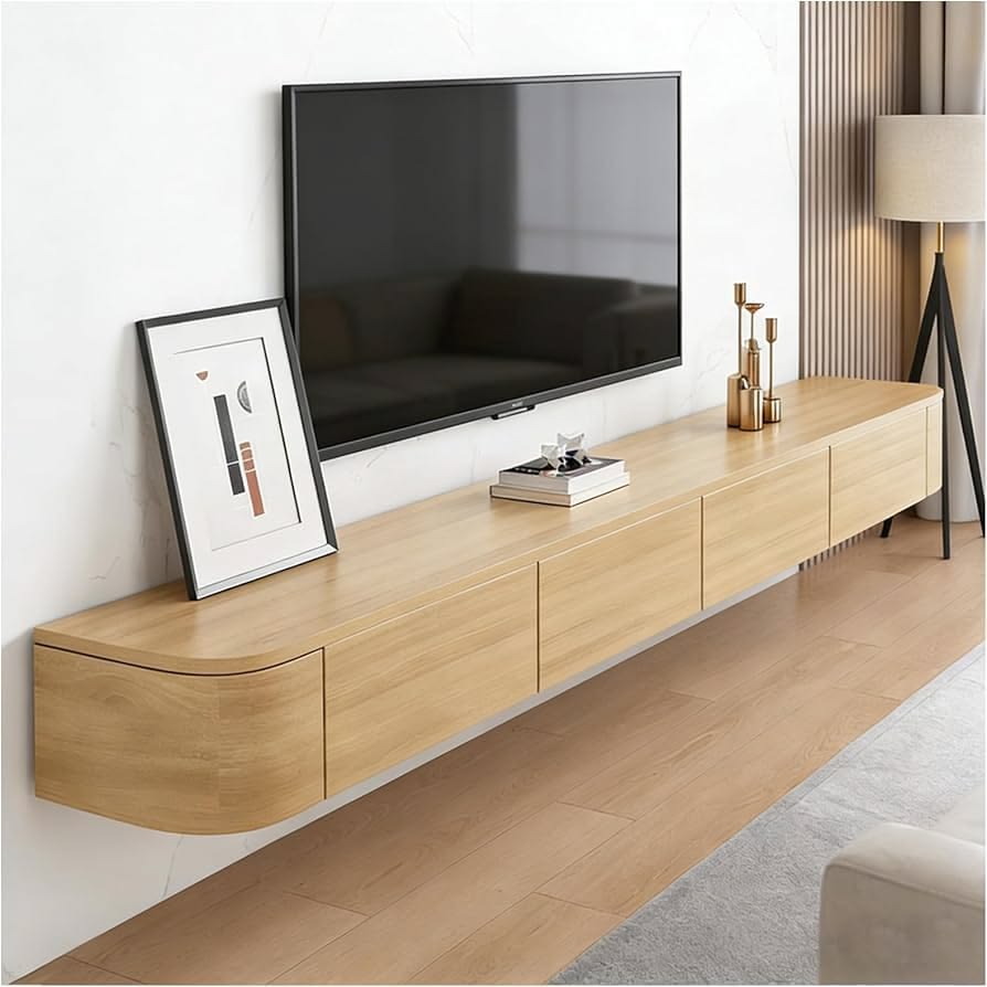 Light wood floating TV unit mounted beneath a television