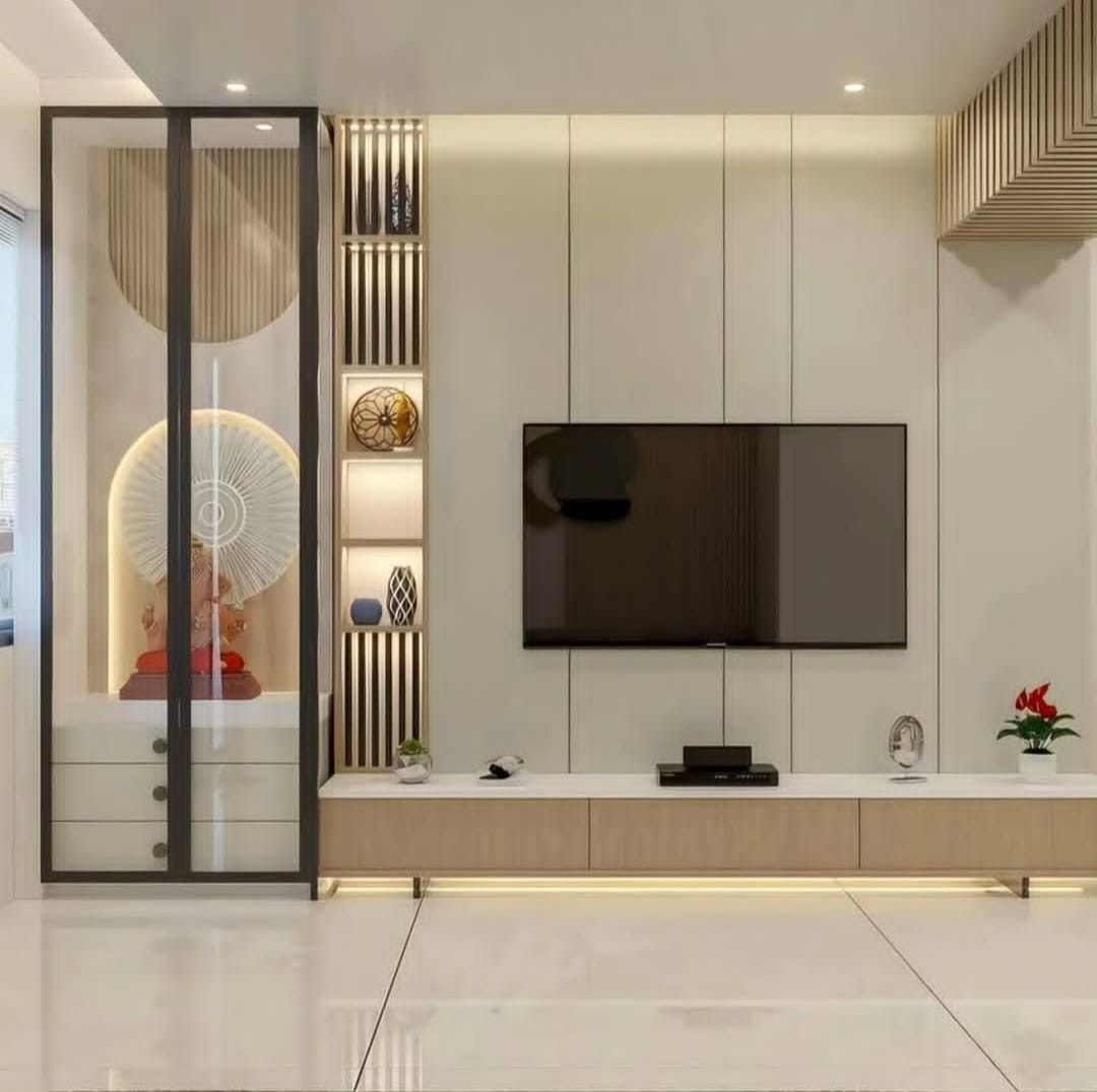 Minimal TV wall integrated with an illuminated pooja unit