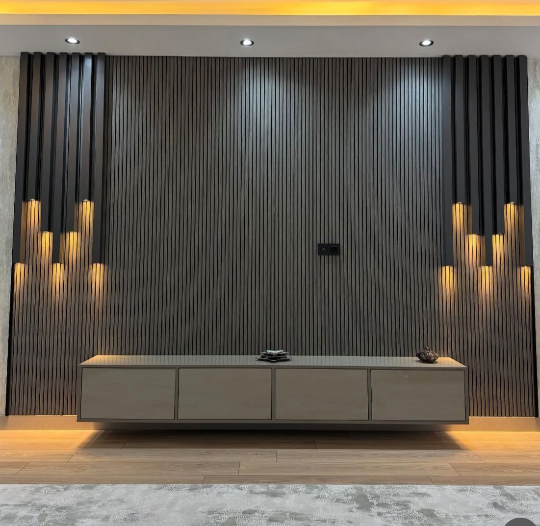 Dark fluted TV wall with sculptural lighting and a floating console